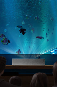 a family watching an ocean-themed show on the VAVA 4K Laser TV
