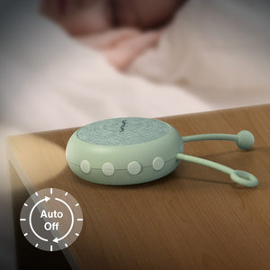 VAVA Twinkle Soother nightlight on a table, blurred sleeping child in the background.