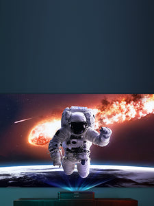 A person in a space suit is projected onto a giant TV screen using an Ultra Short Throw Projector.