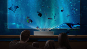 a family watching an ocean-themed show on the VAVA 4K Laser TV