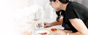 Caregiver checking in on baby on a VAVA baby monitor