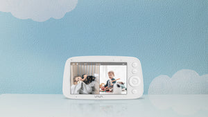 VAVA Baby Monitor Parent Unit in split screen mode against a blue backdrop