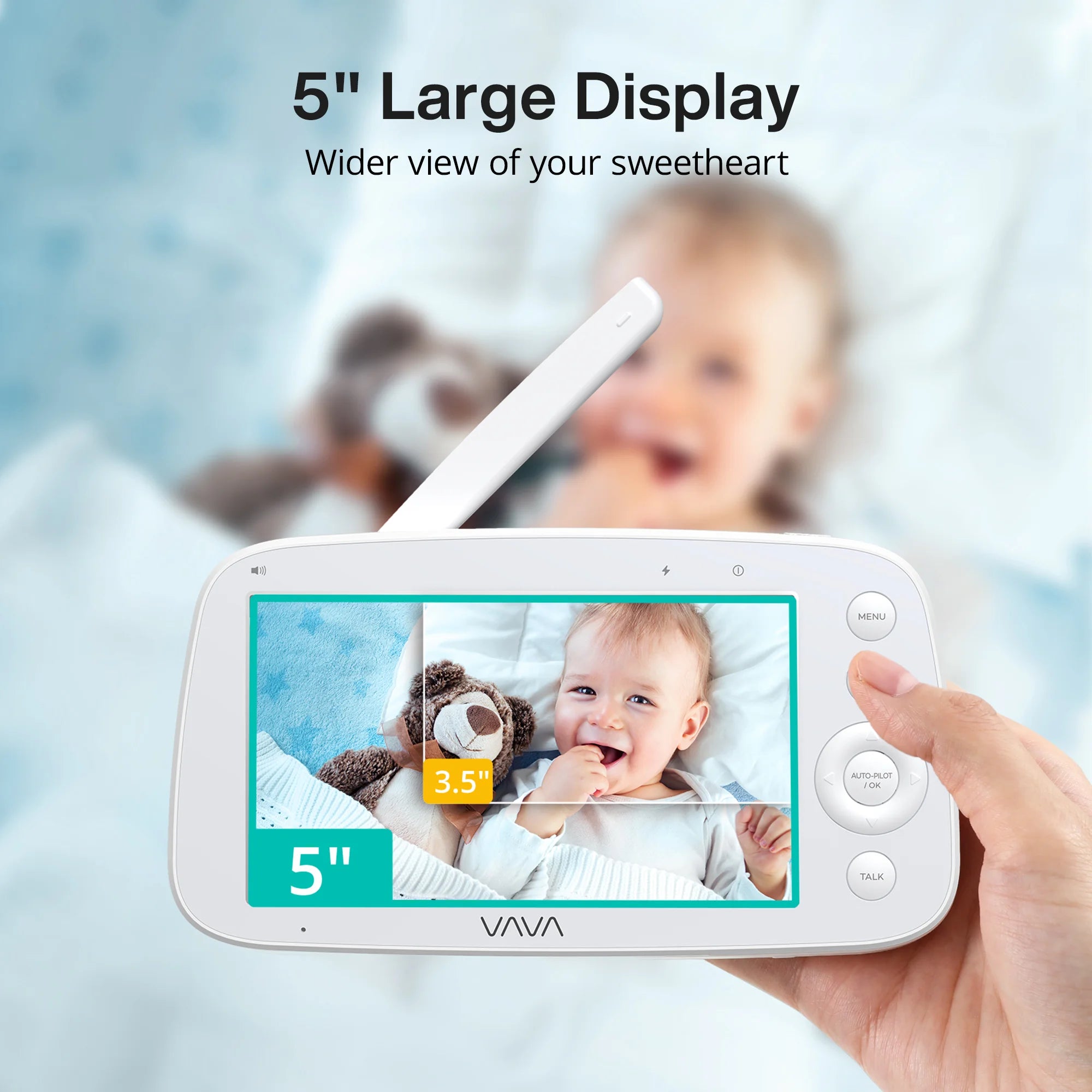 Baby monitor with 5-inch display held by a hand, showing a baby on the screen with a blurred background.