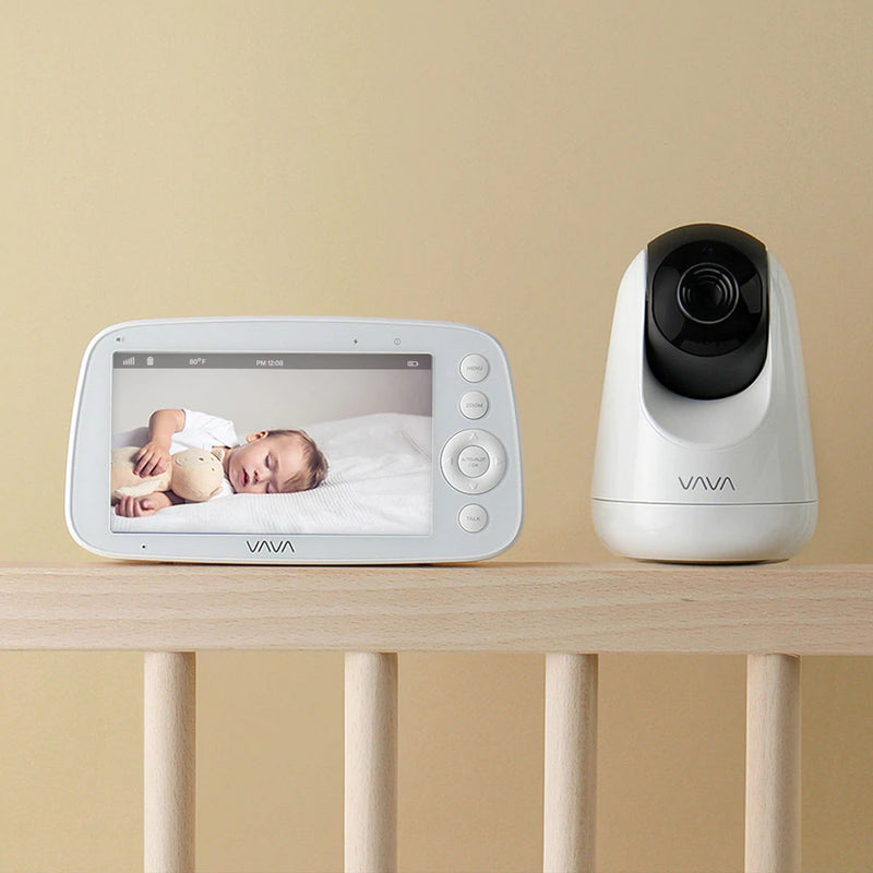 VAVA baby monitor and camera on a crib railing
